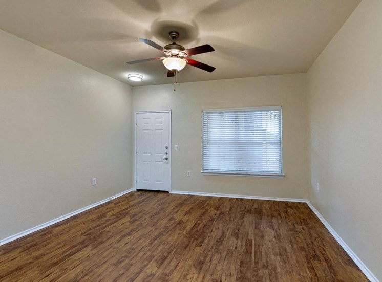 Living room with ceiling fan and hardwood style floors